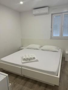Postel nebo postele na pokoji v ubytování Apartments Vinko