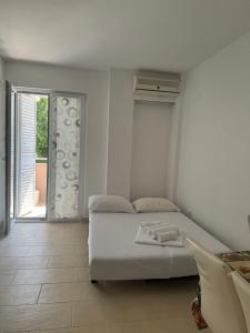 Postel nebo postele na pokoji v ubytování Apartments Vinko