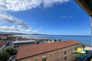 a view of the ocean from a building at Maremma Holidays-Gardenia Apartment in Follonica
