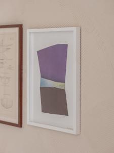 a picture of a painting hanging on a wall at Hôtel Liautaud Rooftop Cassis in Cassis