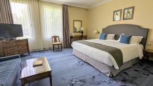 Postel nebo postele na pokoji v ubytování Relais de Margaux - Hôtel, Golf & Spa