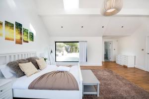 Ένα ή περισσότερα κρεβάτια σε δωμάτιο στο Country Chalet New Forest