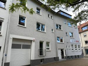 a large gray building with a garage at apartment11 in Ulm