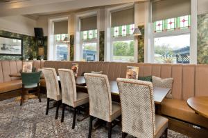 a dining room with a table and chairs at Blue Bell Lodge Hotel in Middlesbrough