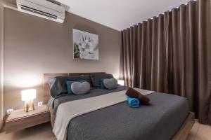 Voodi või voodid majutusasutuse Vue imprenable sur le lagon, appartement 1ch 4p toas