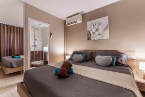 Postel nebo postele na pokoji v ubytování Vue imprenable sur le lagon, appartement 1ch 4p