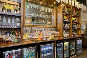 a bar with a lot of bottles of alcohol at Blue Bell Lodge Hotel in Middlesbrough