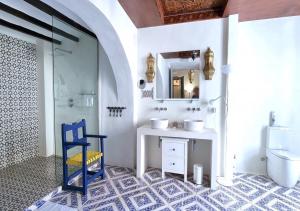 a bathroom with a sink and a mirror at Boutique B&B Número Cuatro in Benissa