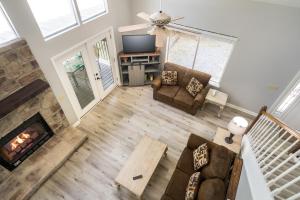 an overhead view of a living room with a fireplace at Autumn Breeze By Stony Brook Cabins in Gatlinburg +10 photos