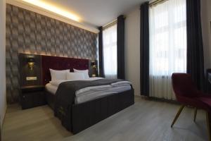 Postel nebo postele na pokoji v ubytování Hotel Grand Inn Berlin - Weißensee