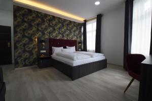 Postel nebo postele na pokoji v ubytování Hotel Grand Inn Berlin - Weißensee + 2 fotografie