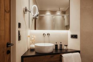 a bathroom with a large white sink on a counter at Luxury Chalet Milé in Ortisei +94 photos