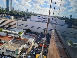 an aerial view of a city with buildings and cars at Lindo flat no Manaíra Apart Hotel in João Pessoa