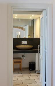 a bathroom with a sink and a mirror at B&B Finestra Sul Mare in Gallipoli