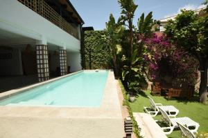 a swimming pool in the backyard of a house at Vila d'Alba in Sant Andreu de Llavaneres