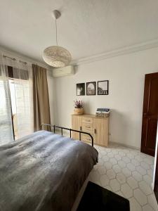 Postel nebo postele na pokoji v ubytování Apartamentos Sol da Luz