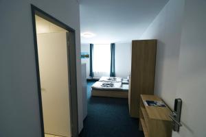 Postel nebo postele na pokoji v ubytování Apartmány Plzeň Zborovská 22 a