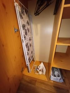a room with a bunk bed and a ladder at Apartamenty z ogrodem 2 typu studio in Mrągowo