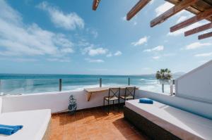 a bathroom with a view of the ocean at Casa Roque in Haría