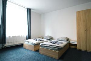 Postel nebo postele na pokoji v ubytování Apartmány Plzeň Zborovská 22 a