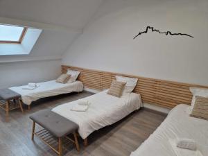 Postel nebo postele na pokoji v ubytování Coeur de Reigny