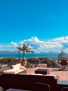 a living room with a view of the ocean at Panorama Love to Stay in Ercolano