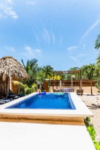 a swimming pool in a resort at Atenea Holbox in Holbox Island