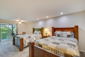 a bedroom with two beds and a balcony at Screened Deck Margaritaville Lake Resort Retreat! in Osage Beach +34 photos