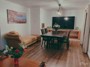 a living room with a table and a couch at Family Vacation Home with Pool in Sarasota