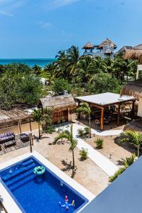 an aerial view of a resort with a swimming pool and the beach at Atenea Holbox in Holbox Island