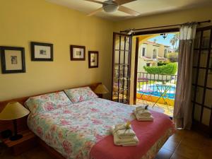 a bedroom with a bed with towels on it at Lluna Beach Bará in Roda de Bará