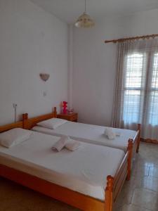 Ένα ή περισσότερα κρεβάτια σε δωμάτιο στο Anthula Apartments