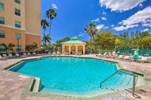 a swimming pool at a hotel with a gazebo at Bayfront Punta Gorda Condo Rental with Pool Access! in Burnt Store Marina