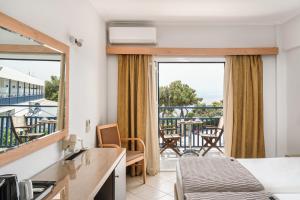 a hotel room with a view of a balcony at Danae Hotel in Egina