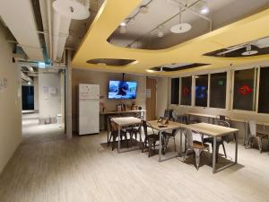 Sjónvarps- og/eða afþreyingartæki á 日初青旅 Sundaily Hostel 北車
