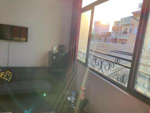a room with a view of a balcony at Elegant Hostel Saigon - District 3 in Ho Chi Minh City