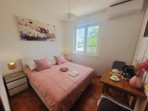 Postel nebo postele na pokoji v ubytování Apartments Blazevic