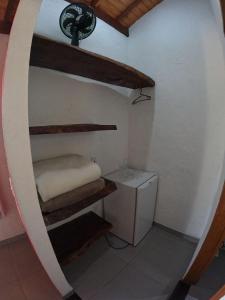 a small room with a bunk bed and a sink at Chalés Vila Real - Tranquilidade na Serra de Carrancas - Piscina com uma vista espetacular do Pôr do Sol in Carrancas