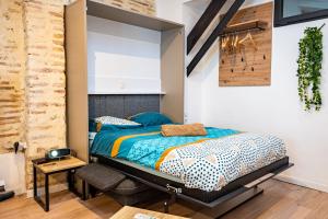 Un ou plusieurs lits dans un hébergement de l'établissement Les suites du castillet