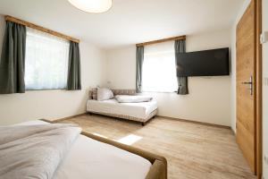 Ένα ή περισσότερα κρεβάτια σε δωμάτιο στο DoppelHerz