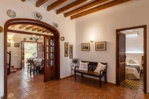 a living room with a bed and a table at Villa Almadrava - Puerto Pollensa - Llenaire in Pollença