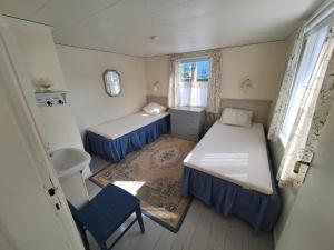 Uma cama ou camas num quarto em Gillet i Borgholm