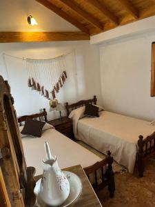 En eller flere senger på et rom på Casa Rural Quilla