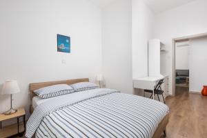 Llit o llits en una habitació de Liceo apartment