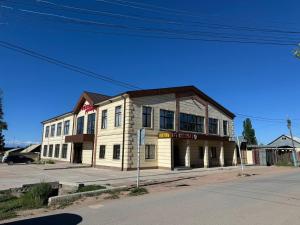 a building on the corner of a street at Айкол in Bokonbayevo