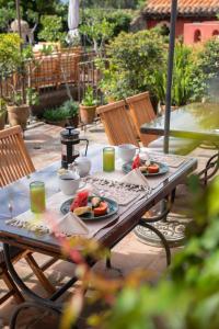 a picnic table with plates of food on it at Posada del Angel in Antigua Guatemala