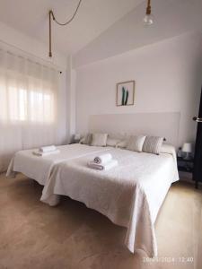 Ένα ή περισσότερα κρεβάτια σε δωμάτιο στο Apartamento Campo Golf Hoyo 18