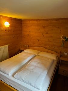 Postel nebo postele na pokoji v ubytování Hotel Miramonti