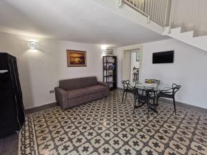 a living room with a couch and a table at Aquarius Salento in Acquarica del Capo
