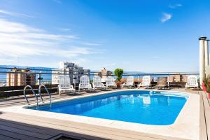a swimming pool on the roof of a building at Amérian Catamarca in San Fernando del Valle de Catamarca